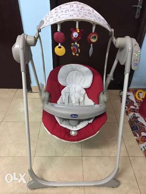Baby's White And Red Chicco Swing Highchair