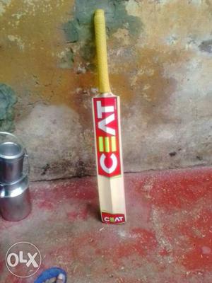 Red, Beige And Yellow Cricket Bat