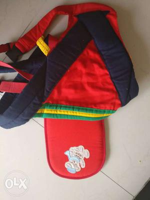 Red, Blue, Green, And Yellow baby Carrier