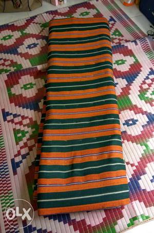 Green And Orange Striped Textile
