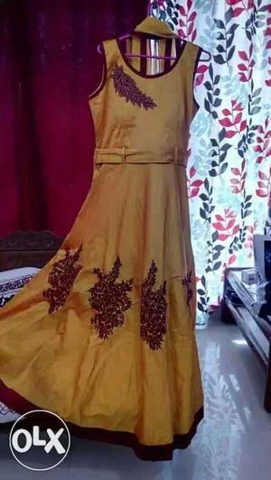 New party long gown yellow for rs./- brown n