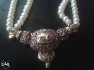 Silver pendant in manek with culture pearls