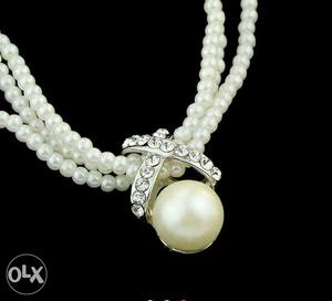 White Pearl And Diamond Pendant Necklace