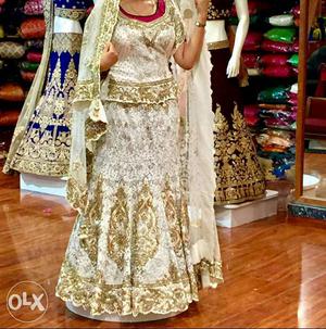Whitish party wear lehenga imported from outside of state