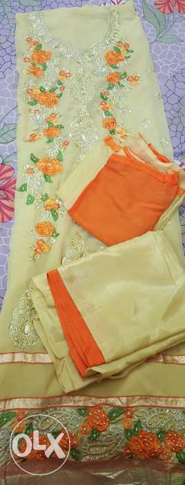 Beige And Orange Floral Textile