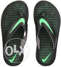 Black-and-green Nike Flipflops