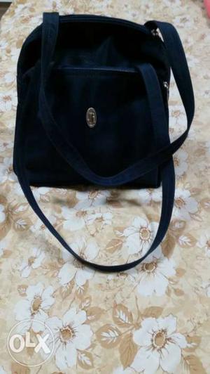 Fashionable ladies hand bag. Deep blue colour