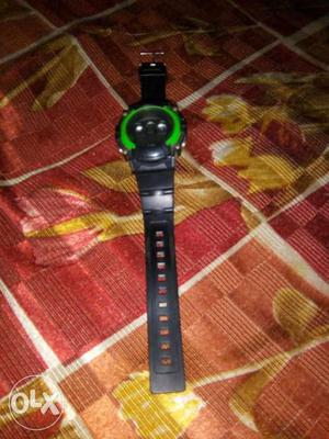 Round Black And Green Digital Watch With Black Rubber Strap