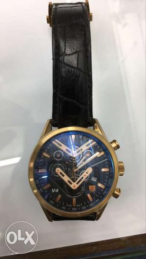 Round Gold Framed Skeleton Chronograph Watch With Black
