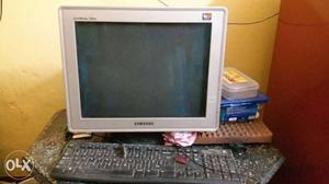 Silver Samsung CRT Computer Monitor with key board and mouse