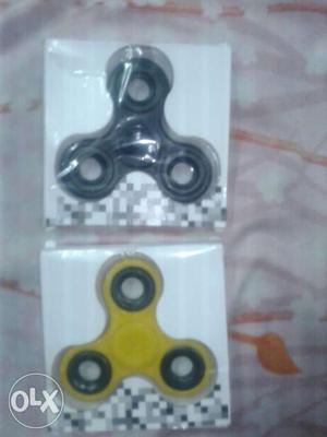 Two Black And Yellow 3-bladed Fidget Spinners With Box