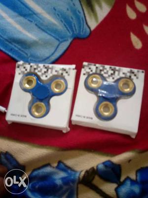 Two Blue And Gold Fidget Spinners In Box