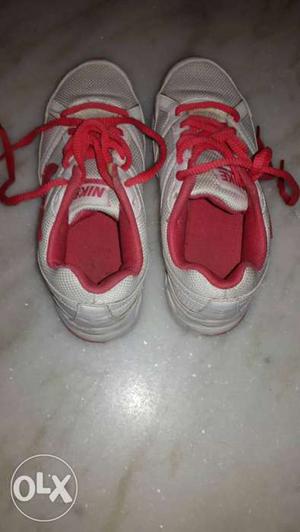 White-and-red Nike Running Shoes