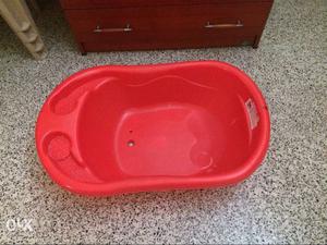 Baby bath tub with drain at the bottom..