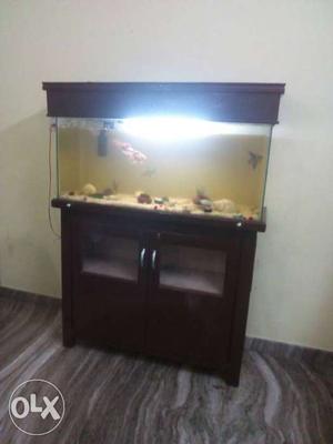 It is an aquarium and almirah suitable for living