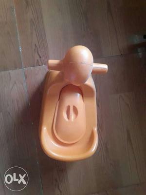 New Toddler's Orange Potty Trainer.Not even once used.
