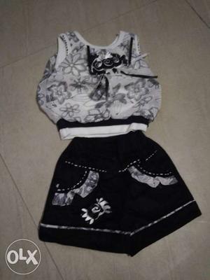 White And Gray Floral Top; Black Mini Skirt
