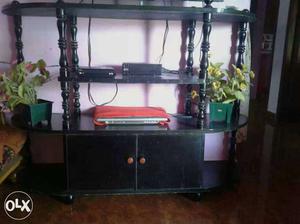 A black colour tv stand for a big one for cheap