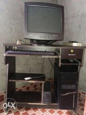 Black Computer Desktop Set And Brown Wooden Desk