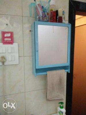 Blue Framed Mirror With Towel Rack