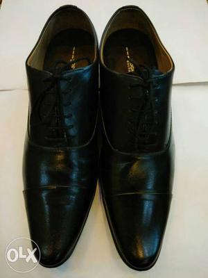 Brand new black leather shoe size 10.