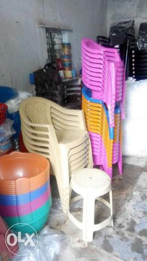 Brown, Blue, Yellow And Pink Plastic Armchairs
