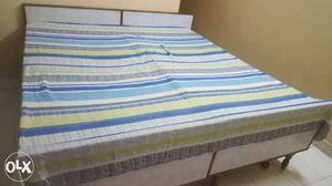 Double cot bed made of pure teak for sale.