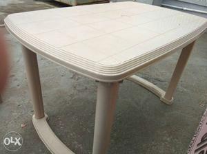 Light cream colour plastic table only used for 15