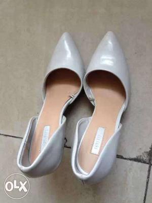 Pair Of White Patent Leather D'orsay Pointed Heeled Shoes