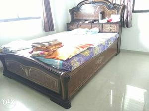 Queen size double bed without mattress.
