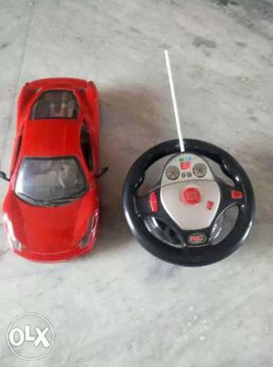 Red, Black And Gray Remote Controlled Car Toy