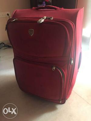 Red second hand suitcase