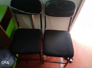 Two Black Armless Chairs