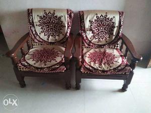 Two Brown Wooden Padded Armchairs