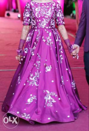 A wine colour gown, embellished with complete