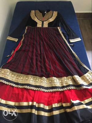 Black, Red, And Gold-colored Traditional Dress