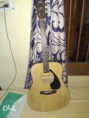 Brown And Beige Yamaha Acoustic Guitar