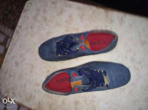Pair Of Blue-and-red Shoes