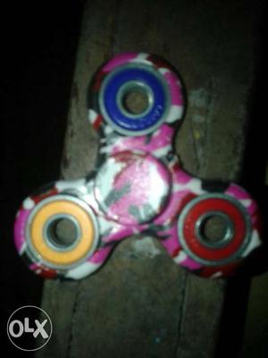 Pink, Yellow, And Blue Fidget Hand Spinner