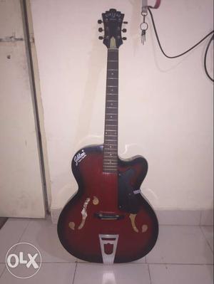 Red And Black Cutaway Jazz Guitar