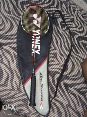 Red And White Yonex Badminton Racket