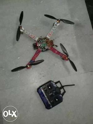 Red-and-white Quadcopter With Remote Controll
