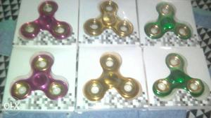 Six Pink, Yellow, And Green Fidget Hand Spinners