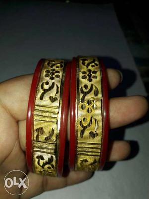 Two Gold-andred Floral Embossed Bangles.size-2.4