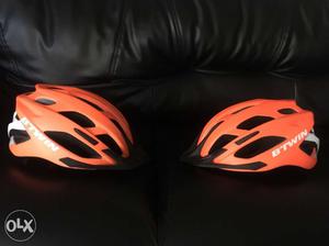 Two Orange BTWin Bicycle Helmet