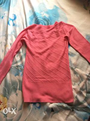 Used woolen top in pink colour in good condition.