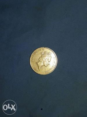 Woman's Profile Embossed Round Gold Coin