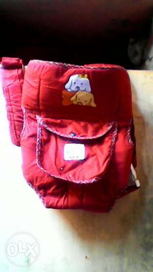 Red baby bag in cry