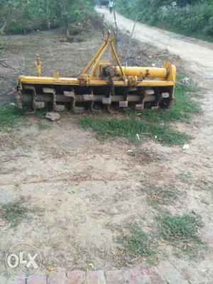 Yellow And Brown Industrial Tiller