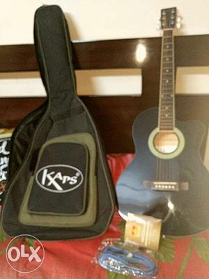 6 months old Kaps acoustic guitar with additional